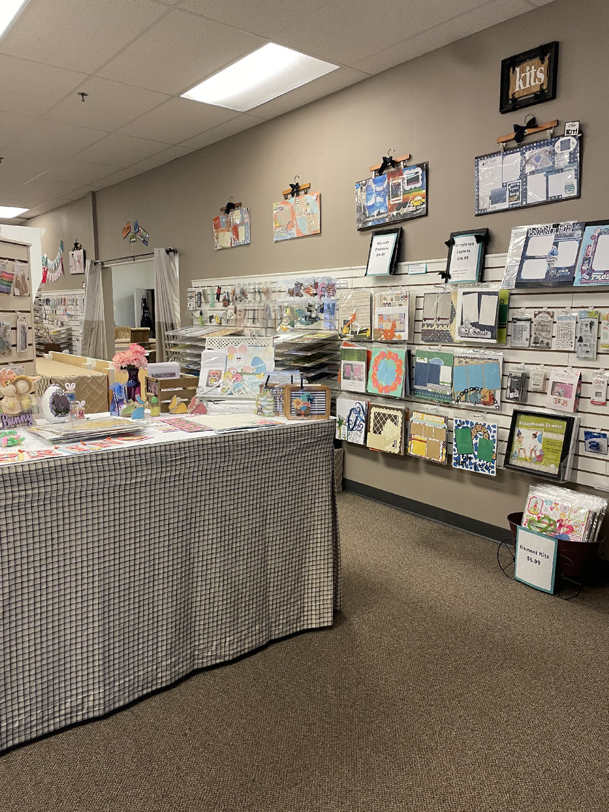 Product wall and scrapbook kits inside the workshop